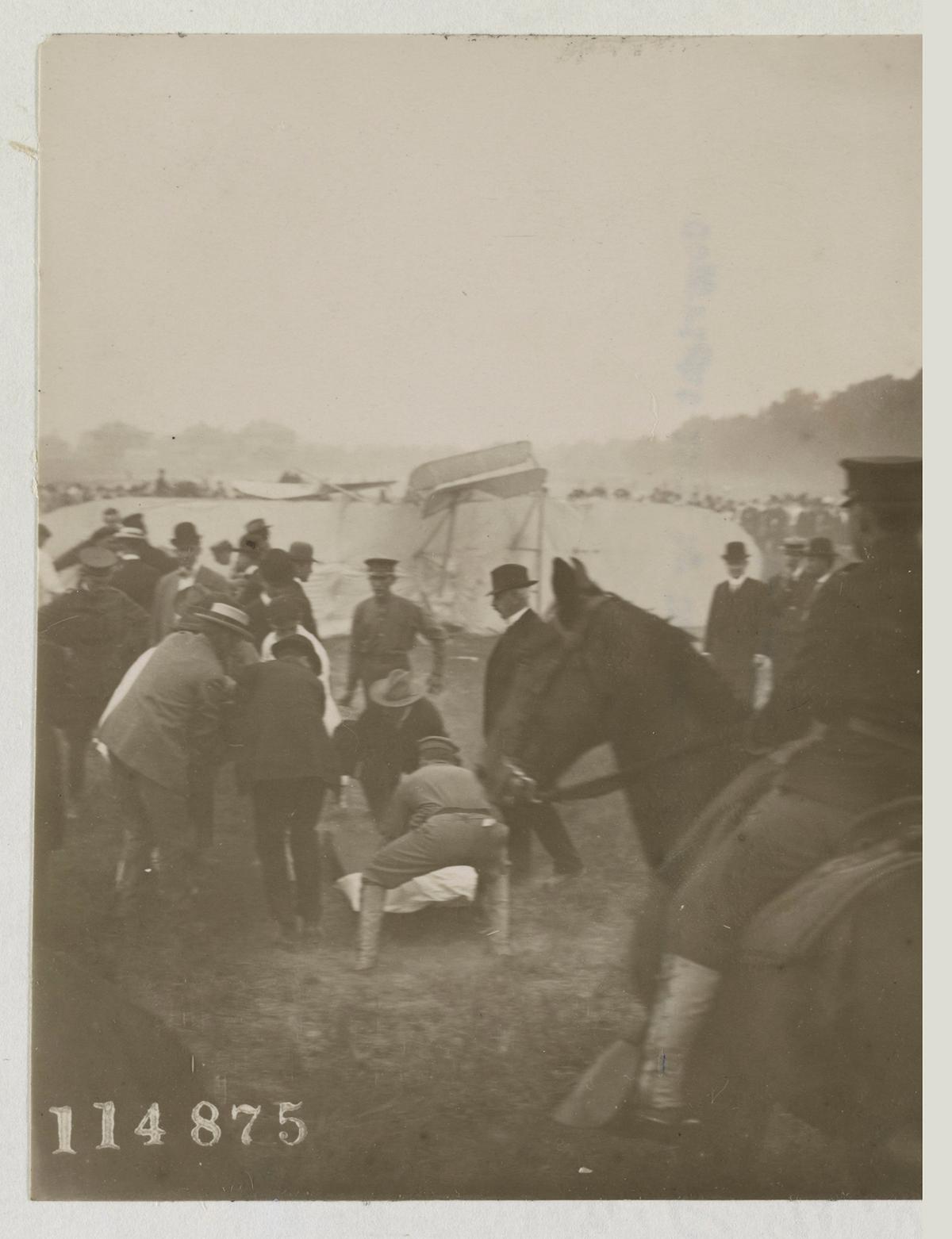 Tending to pilot Orville Wright or passenger Lt. Thomas E. Selfridge after the crash of the Wright Military Flyer at Fort Myer, Va. Library of Congress. (Public Domain)