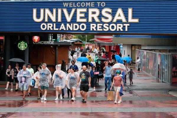 Tourists exit Universal Orlando Resort as they were closing early for the arrival of Hurricane Milton, in Orlando, Fla., on Oct. 9, 2024. (John Raoux/AP Photo)