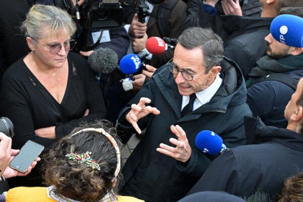 France's Minister of the Interior Bruno Retailleau (R), surrounded by journalists, reacts next to a resident during a visit focused on drug trafficking in Rennes, western France, on Nov. 1, 2024. (Damien Meyer / AFP via Getty Images)