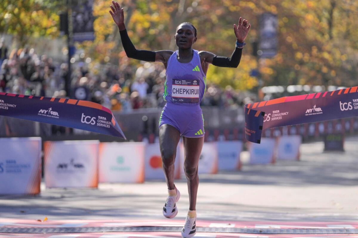 Kenya's Sheila Chepkirui crosses the finish line to win the women's division of the New York City Marathon on Nov. 3, 2024. (Frank Franklin II/AP Photo)