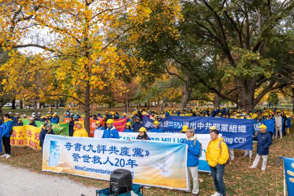 People gather at a rally to commemorate the 20th anniversary of the publication of “Nine Commentaries on the Communist Party,” a book detailing the Chinese regime’s totalitarian rule and human rights abuses, at Queen’s Park in downtown Toronto on Nov. 2, 2024. (The Epoch Times)