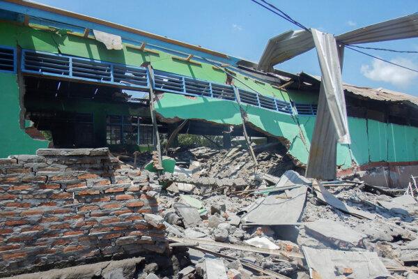 A collapsed building is seen in Klatanlo village, in East Flores Regency, East Nusa Tenggara, on Nov. 4, 2024, in the aftermath of Mount Lewotobi Laki-Laki's eruption overnight. (Arnold Welianto/AFP via Getty Images)