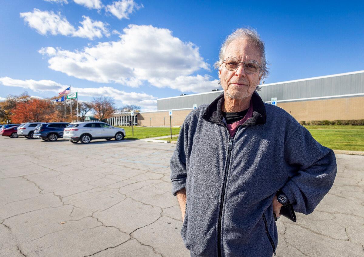 Bill Keller said he was discouraged by long lines on the first day of early voting in Farmington Hills, Mich., on Oct. 26, 2024. (John Fredricks/The Epoch Times)