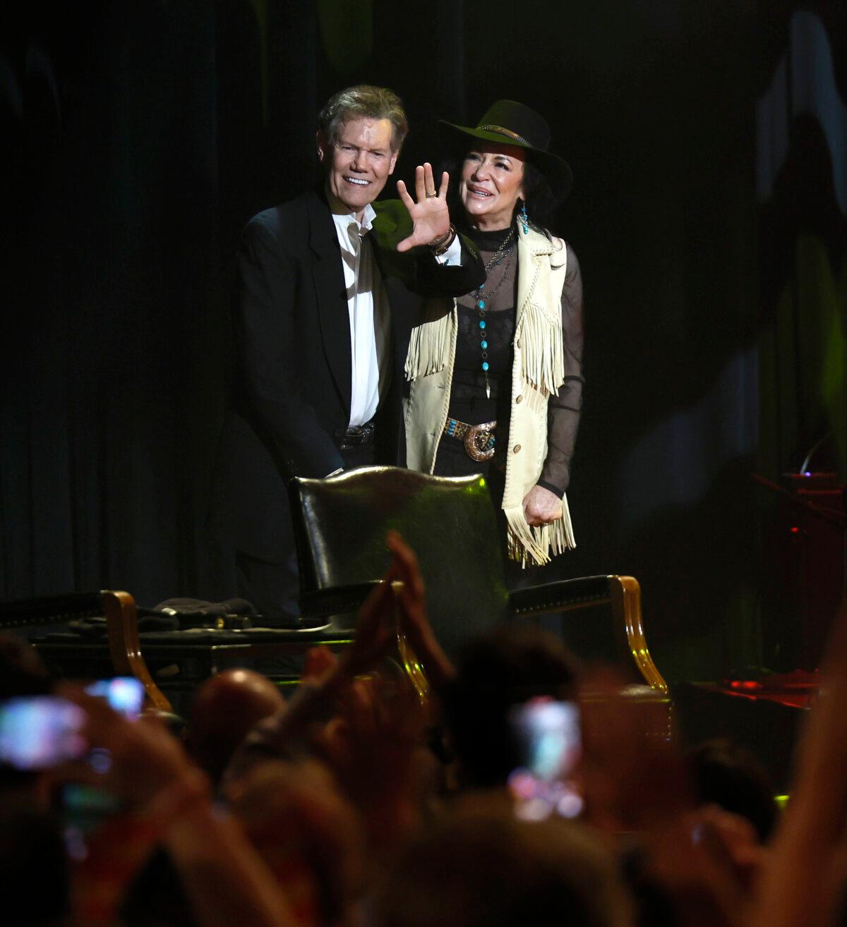 Randy Travis and his wife, Mary Travis, onstage during the "More Life Tour" at the Ryman Auditorium in Nashville on June 5, 2024. (Jason Kempin/Getty Images)
