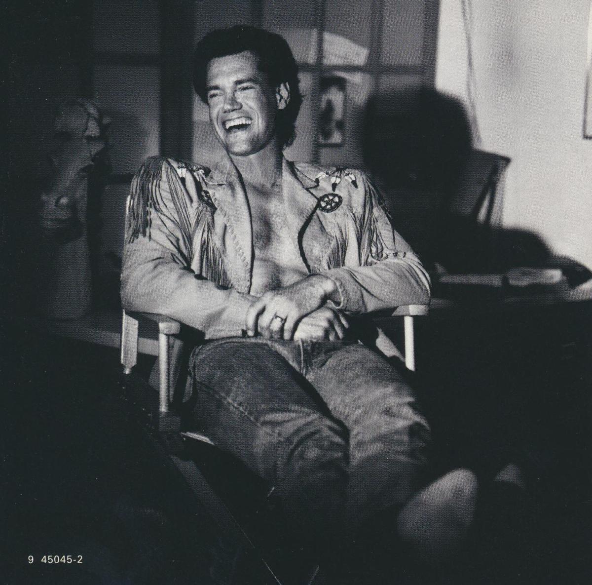 An album insert of Randy Travis from his 1992 "Greatest Hits Volume Two," featuring hit song "Forever and Ever, Amen." Internet Archive. (Public Domain)