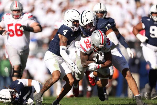 TreVeyon Henderson, #32 of the Ohio State Buckeyes, runs the ball during the third quarter against the Penn State Nittany Lions at Beaver Stadium in State College, Penn., on Nov. 2, 2024. (Scott Taetsch/Getty Images)