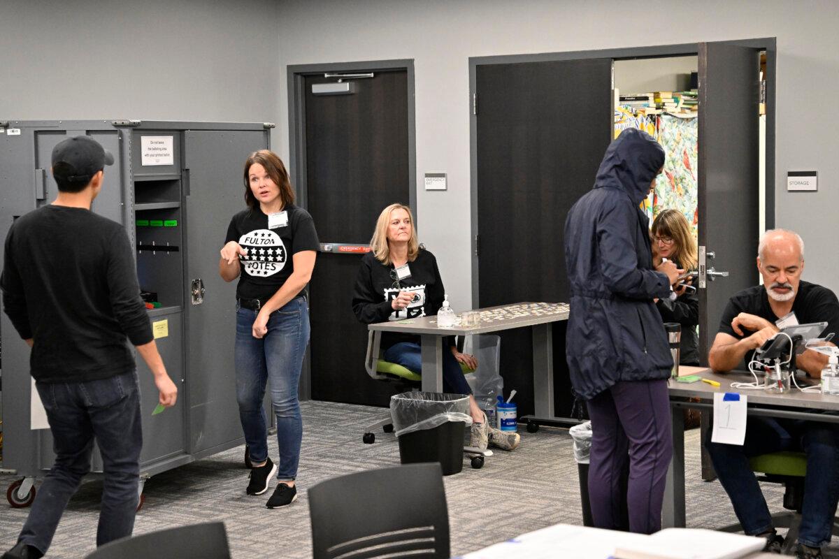 Scenes from inside the Buckhead Library polling location where poll workers assist and voters cast their ballots in Atlanta, Ga., on Nov. 5, 2024. (Jim Blackburn for The Epoch Times)