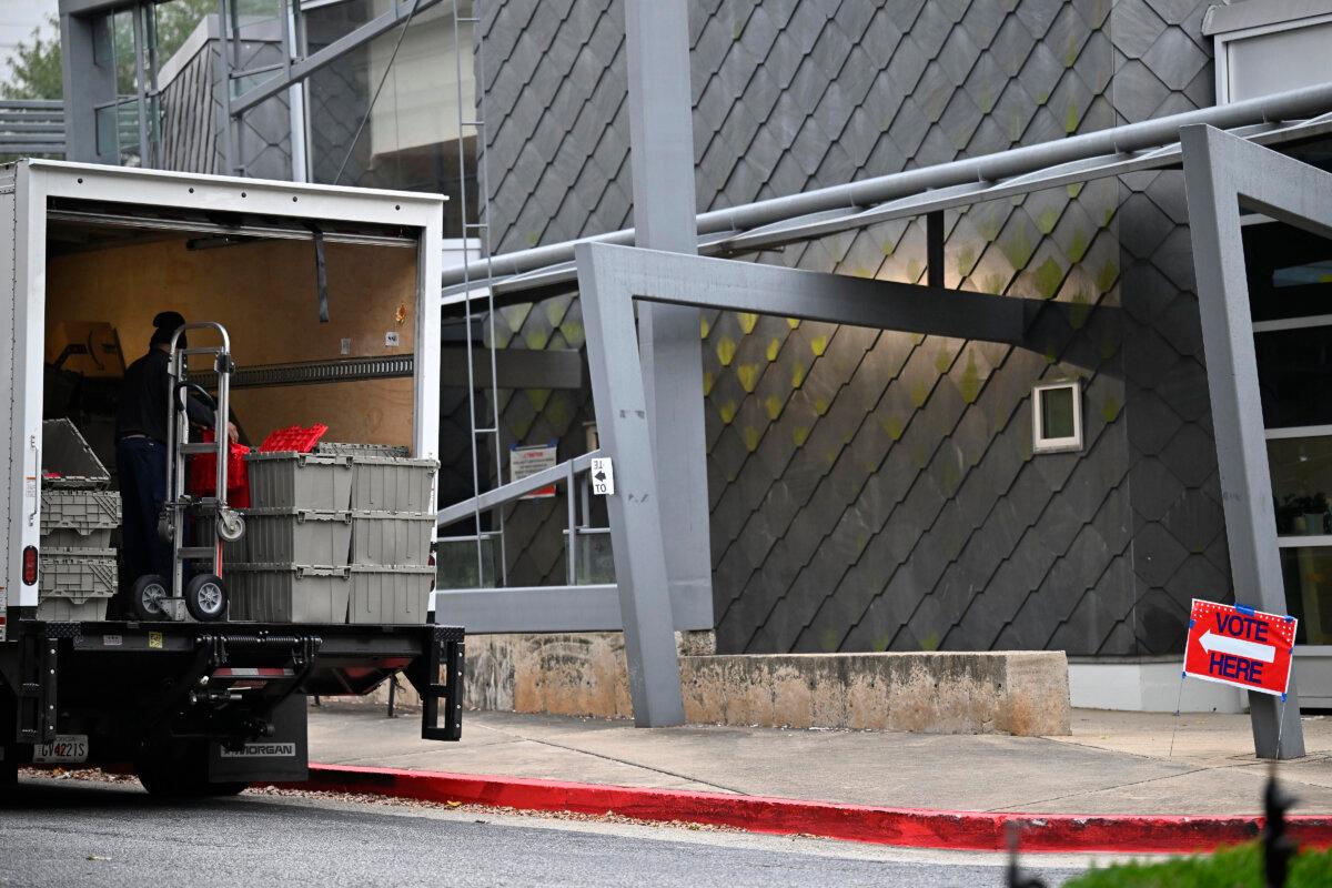 A truck containing plastic bins is parked in front of the Buckhead Library in Atlanta, Ga., on Nov. 5, 2024. (Jim Blackburn for The Epoch Times)