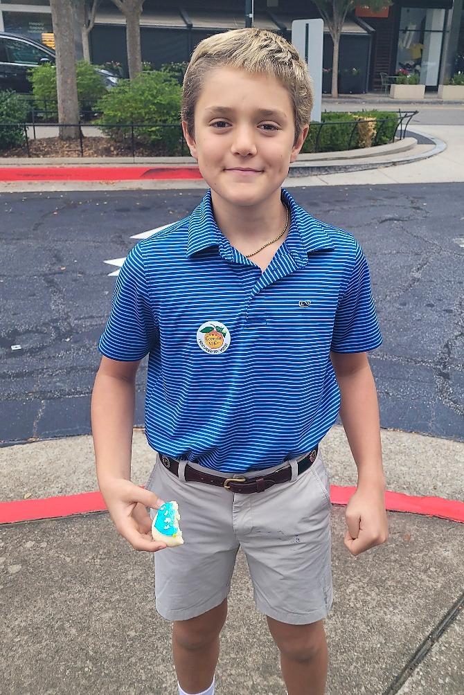 Miles Cage came with his parents to vote at the Buckhead precinct in Atlanta on Nov. 5, 2024. (Stacy Robinson/The Epoch Times)