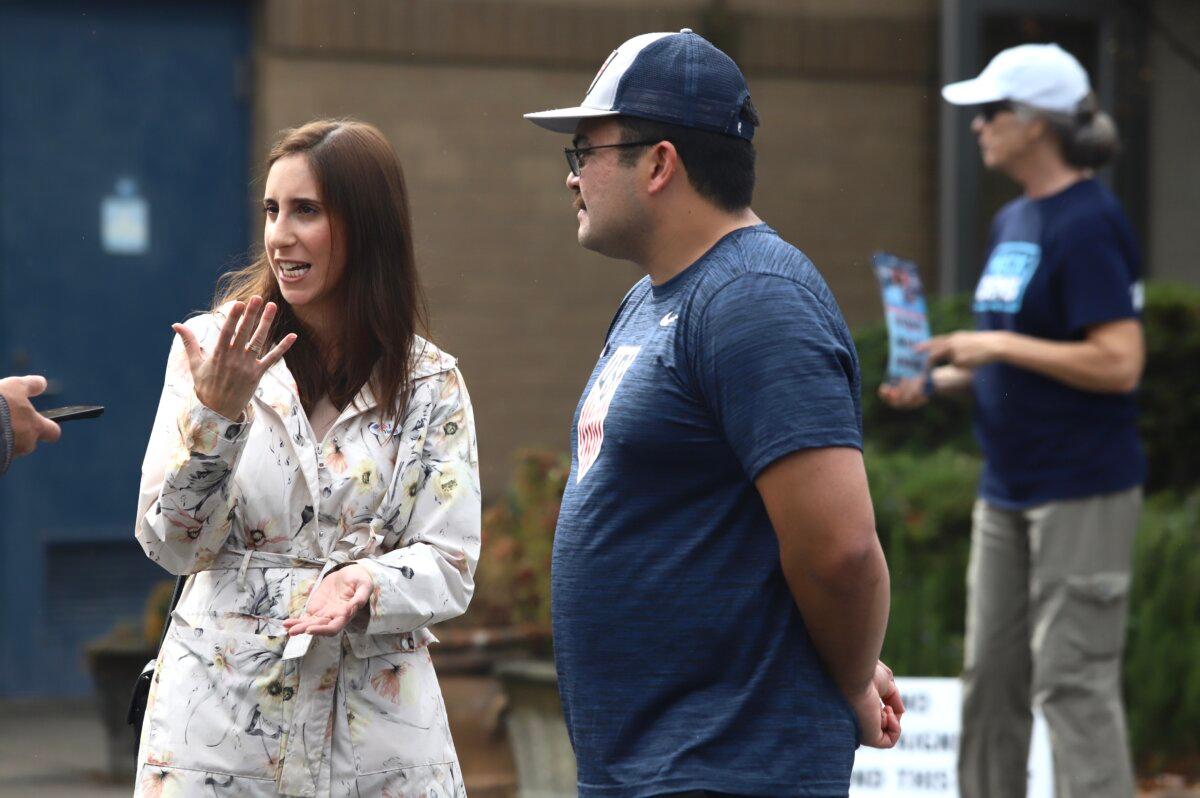 Renee Provost and her fiancée, Christian Daniel, speak to a reporter after having voted in Charlotte, N.C., on Nov. 5, 2024. Renee explained why she voted for Donald Trump in the presidential election, but Christian declined to say who he voted for. (Jennifer Podis for The Epoch Times)