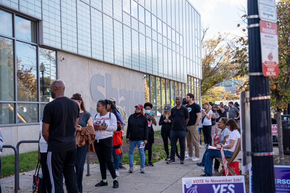 People wait in line to cast their vote at Shaw Neighborhood Library in Washington on Nov. 5, 2024. (Madalina Vasiliu/The Epoch Times)