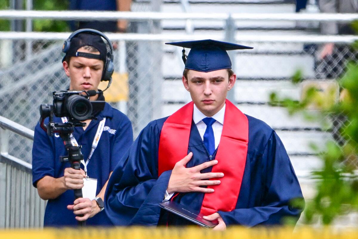 Barron Trump, son of former President Donald Trump and former First Lady Melania Trump, takes part in his graduation at Oxbridge Academy in Palm Beach, Fla., on May 17, 2024. (Giorgio Viera/AFP via Getty Images)