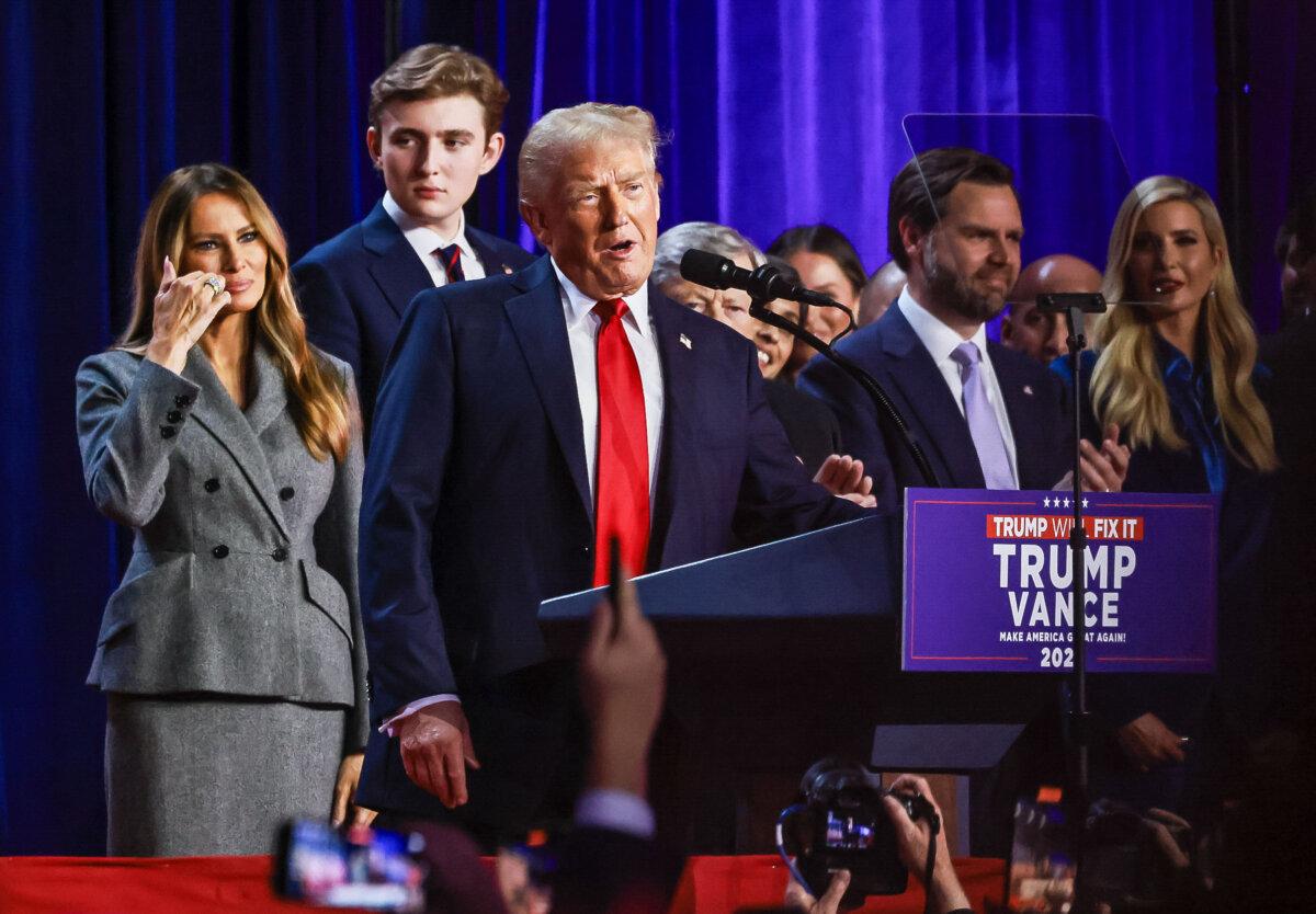 Former President Donald Trump is joined by his family and his running mate as he declares victory at his election night watch party in West Palm Beach, Fla., on Nov. 6, 2024. (John Fredricks/The Epoch Times)