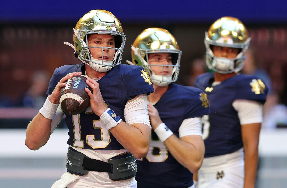 Riley Leonard #13 of the Notre Dame Fighting Irish warms up prior to facing the Georgia Tech Yellow Jackets at Bobby Dodd Stadium in Atlanta, Ga., on Oct.19, 2024. (Photo by Kevin C. Cox/Getty Images)