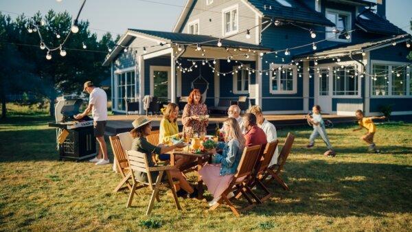 If you are having a backyard barbecue, consider inviting the neighbors. (Gorodenkoff/Shutterstock)