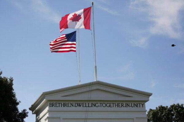 Canadian and American flags are pictured at the Peace Arch Historical State Park at the Canada-U.S. border in Blaine, Washington, on Aug. 9, 2021. (Jason Redmond/AFP via Getty Images)