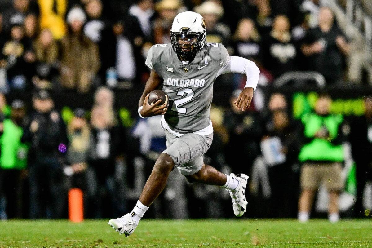 Shedeur Sanders #2 of the Colorado Buffaloes carries the ball in the first quarter against the Cincinnati Bearcats at Folsom Field in Boulder, Colo., on Oct. 26, 2024. (Dustin Bradford/Getty Images)