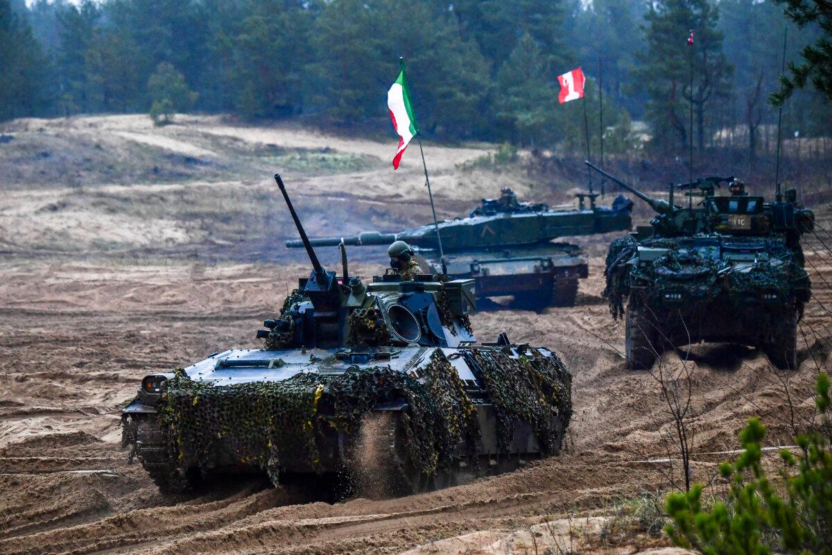 Italian and Canadian fighting vehicles and troops take part in NATO's Resolute Warrior exercise at the Adazi Military Base in Adazi, Latvia, on Nov. 14, 2024. (Gints Ivuskans/AFP via Getty Images)