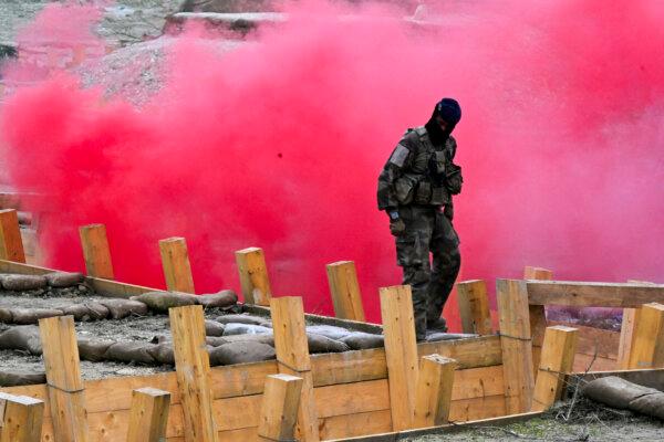 Smoke flares are used as Ukrainian soldiers are trained by the French Army as part of the "Champagne" Task Force, at Mourmelon-le-Grand military camp, in Mourmelon-le-Grand, France, on Nov. 14, 2024. (FRANCOIS NASCIMBENI/AFP via Getty Images)