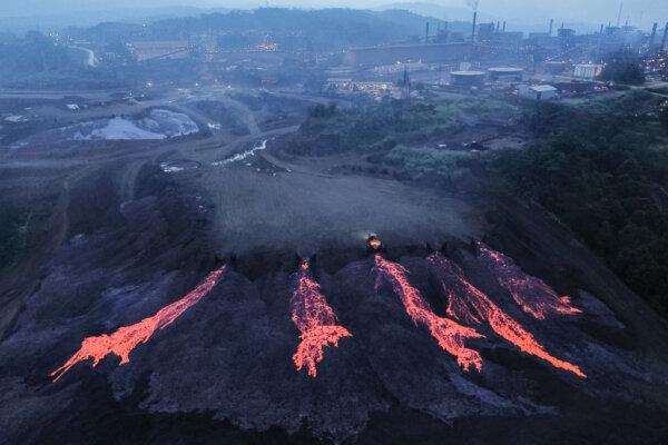 This photo shows an aerial view of the process of disposing of nickel slag waste disposal using a special vehicle at the temporary slag waste storage area of PT Vale Indonesia in Sorowako, South Sulawesi, on Aug. 2, 2024. (Muchtamir Zaide/AFP via Getty Images)