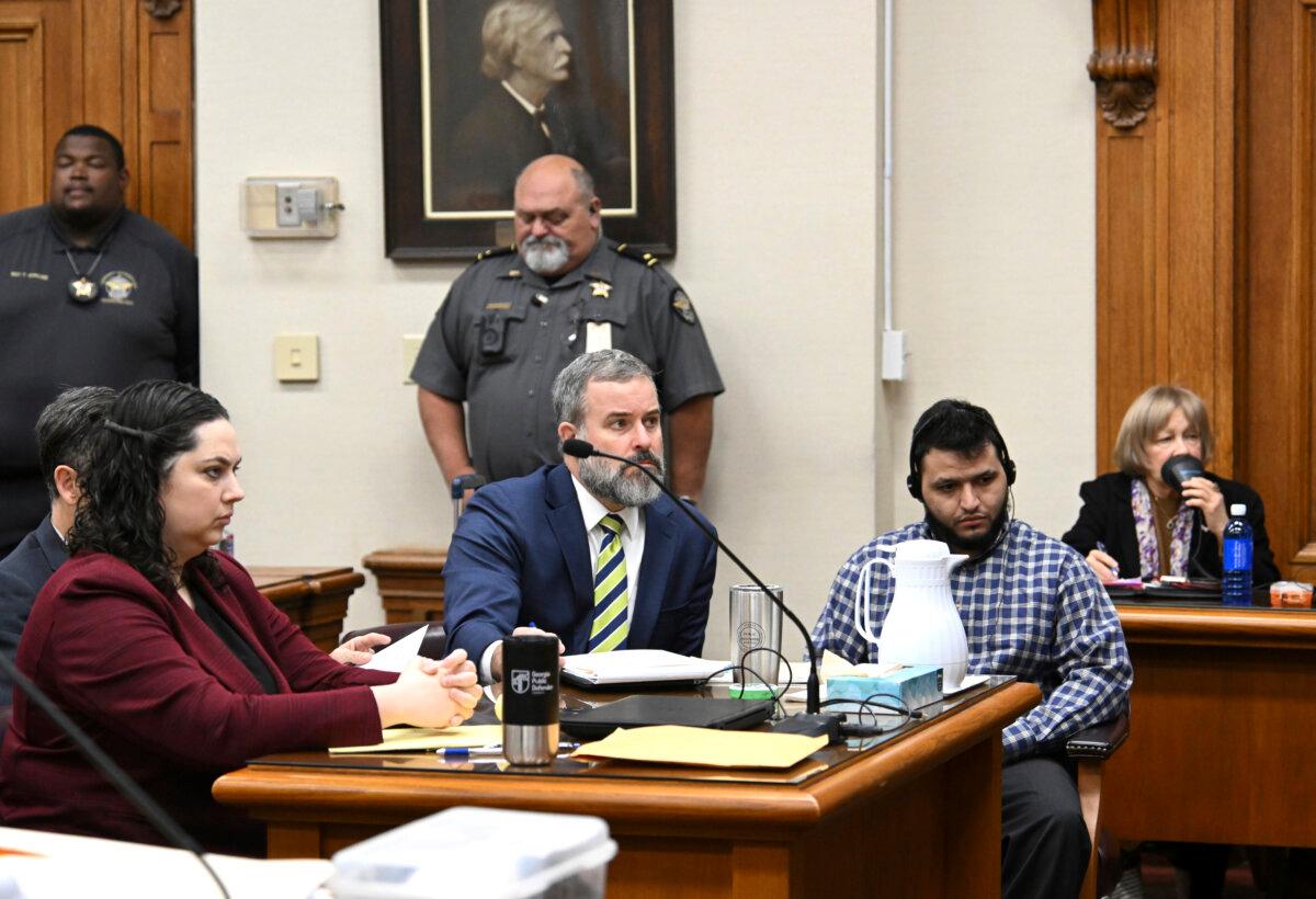 Jose Ibarra (R), accused of killing a Georgia nursing student earlier this year, listens through an interpreter as he sits with his attorneys Dustin Kirby (2nd L) and Kaitlyn Beck (L), during his trial at Athens-Clarke County Superior Court in Athens, Ga., on Nov. 15, 2024. (Hyosub Shin/Atlanta Journal-Constitution via AP, Pool)
