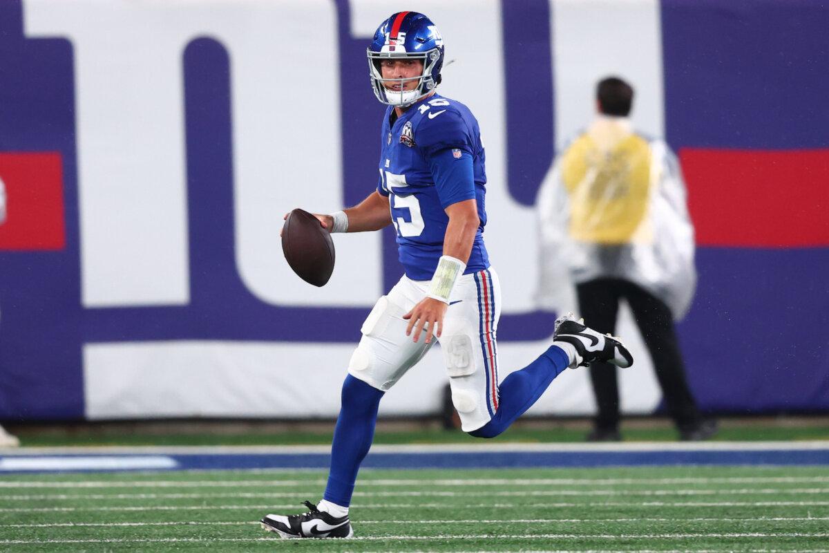 Tommy DeVito, #15 of the New York Giants, runs with the ball during the second half of a preseason game against the Detroit Lions at MetLife Stadium in East Rutherford, N.J. on Aug. 8, 2024. (Ed Mulholland/Getty Images)