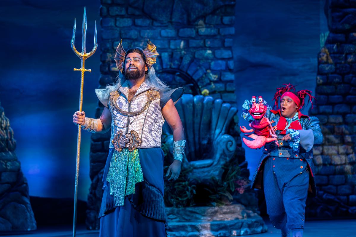 (L-R) King Triton (Anand Nagraj) and Sebastian (Michael Earvin Martin), in "Disney's The Little Mermaid." (Brett Beiner)