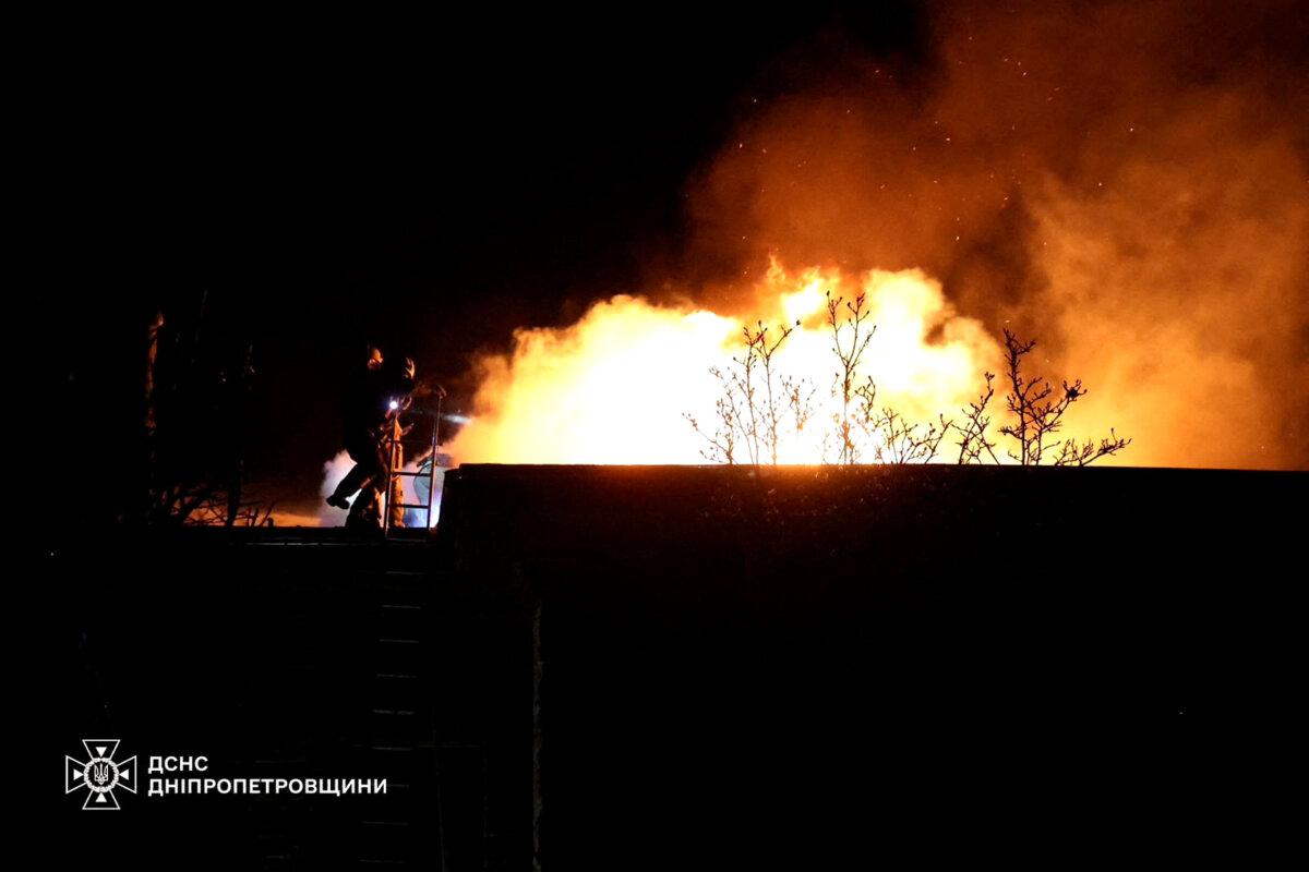 Firefighters work at the site of a Russian missile strike in Dnipro, Ukraine, on Nov. 21, 2024. (Press service of the State Emergency Service of Ukraine in Dnipropetrovsk region/Reuters)