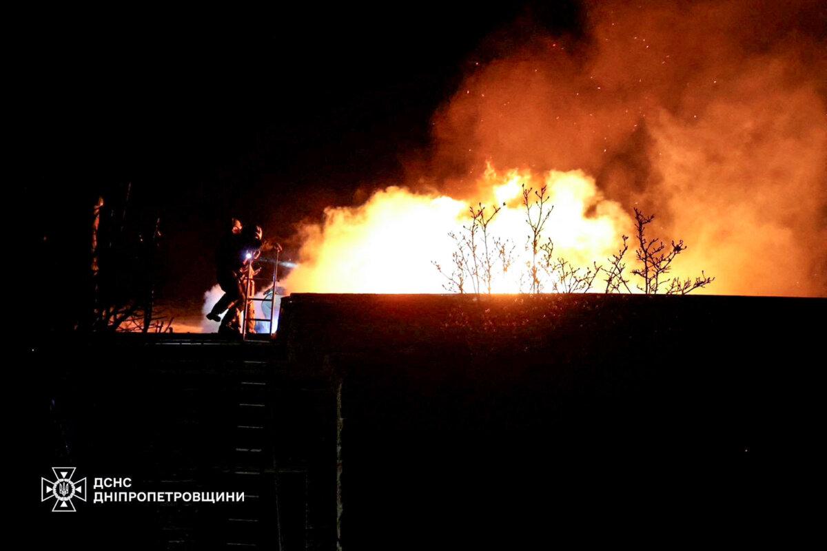 Firefighters work at the site of a Russian missile strike in Dnipro, Ukraine, on Nov. 21, 2024. (Press service of the State Emergency Service of Ukraine in Dnipropetrovsk region/Handout via Reuters)