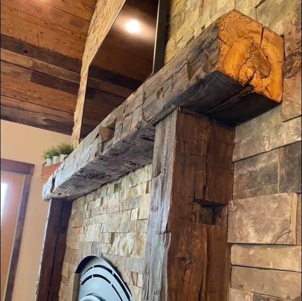 A fireplace framed with reclaimed wood. (Courtesy of Tyler Christman)