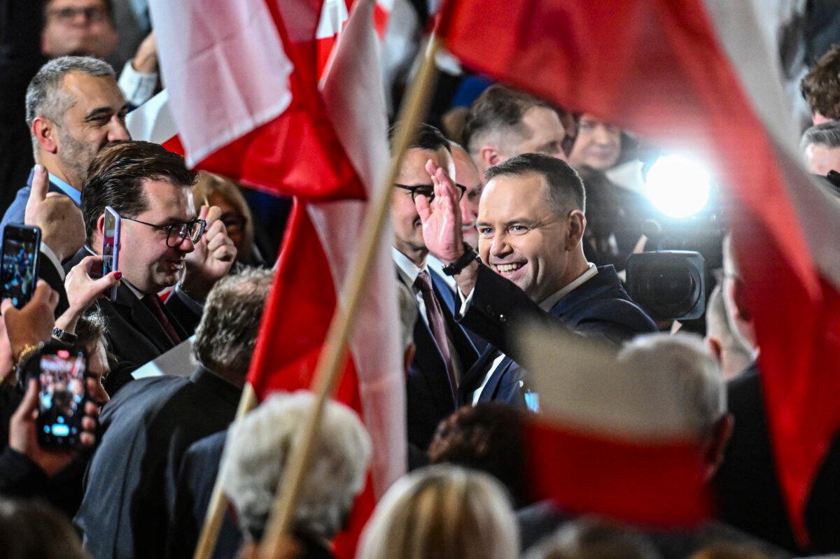 Karol Nawrocki waves to members of the public during the Law and Justice Party convention in Krakow, Poland, on Nov. 24, 2024. (Omar Marques/Getty Images)