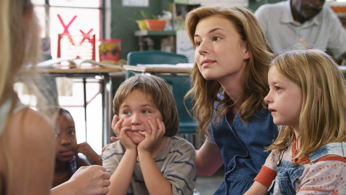 Stacey Bess (Emily VanCamp) with some of her students, in “Beyond the Blackboard.” (MovieStillsDB)