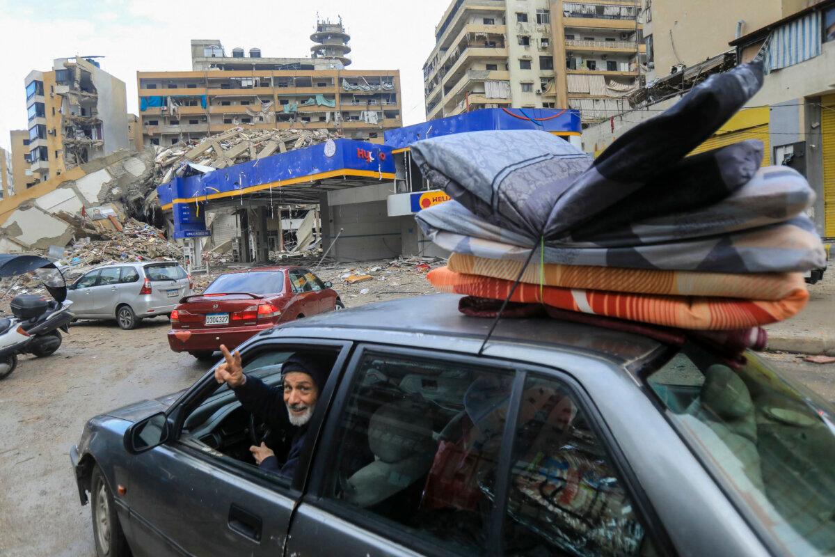 People return with their belongings to their homes in Beirut's southern suburbs on Nov. 27, 2024, after a cease-fire between Israel and Hezbollah took effect. (AFP via Getty Images)