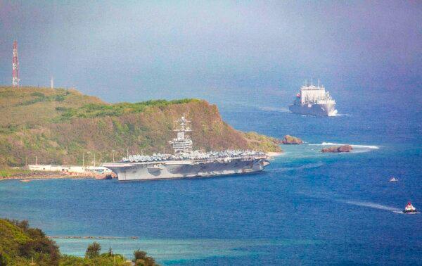 The aircraft carrier USS Theodore Roosevelt is docked at Naval Base Guam in Apra Harbor amid the coronavirus pandemic on April 27, 2020. (Tony Azios/AFP via Getty Images)