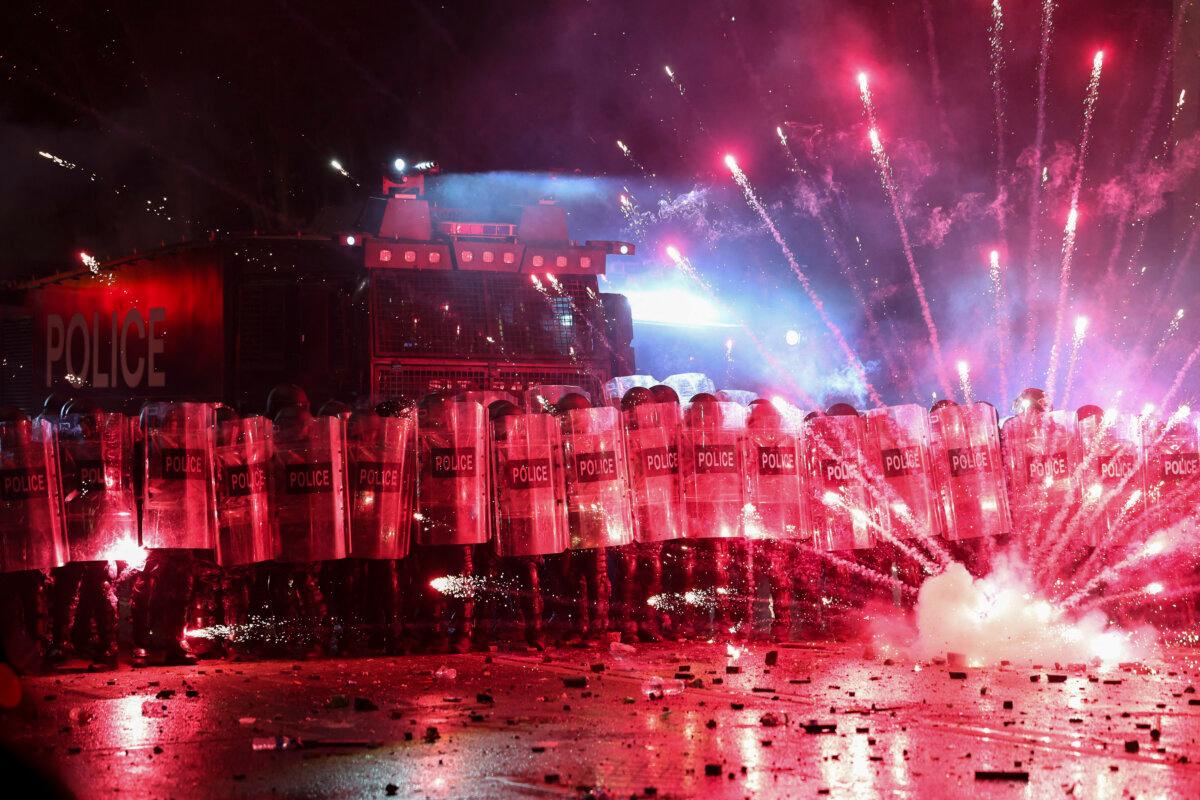Police try to disperse protesters during a demonstration near the Parliament building in downtown Tbilisi on Nov. 30, 2024. (Giorgi Arjevanidze/AFP via Getty Images)