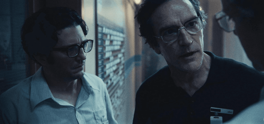 Geoffrey Mason (John Magaro, L) and Marvin Bader (Ben Chaplin) debate the situation with Roone Arledge (Peter Sarsgaard, R), in "September 5." (Paramount Pictures)