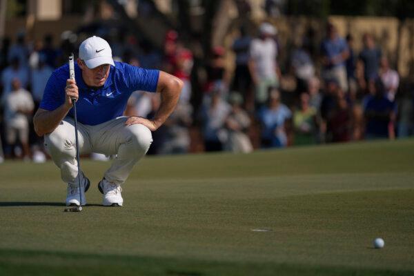 Rory McIlroy of Northern Ireland lines up a putt on the 8th green in the final round of World Tour Golf Championship in Dubai, United Arab Emirates, on Nov. 17, 2024. (Altaf Qadri/AP Photo)