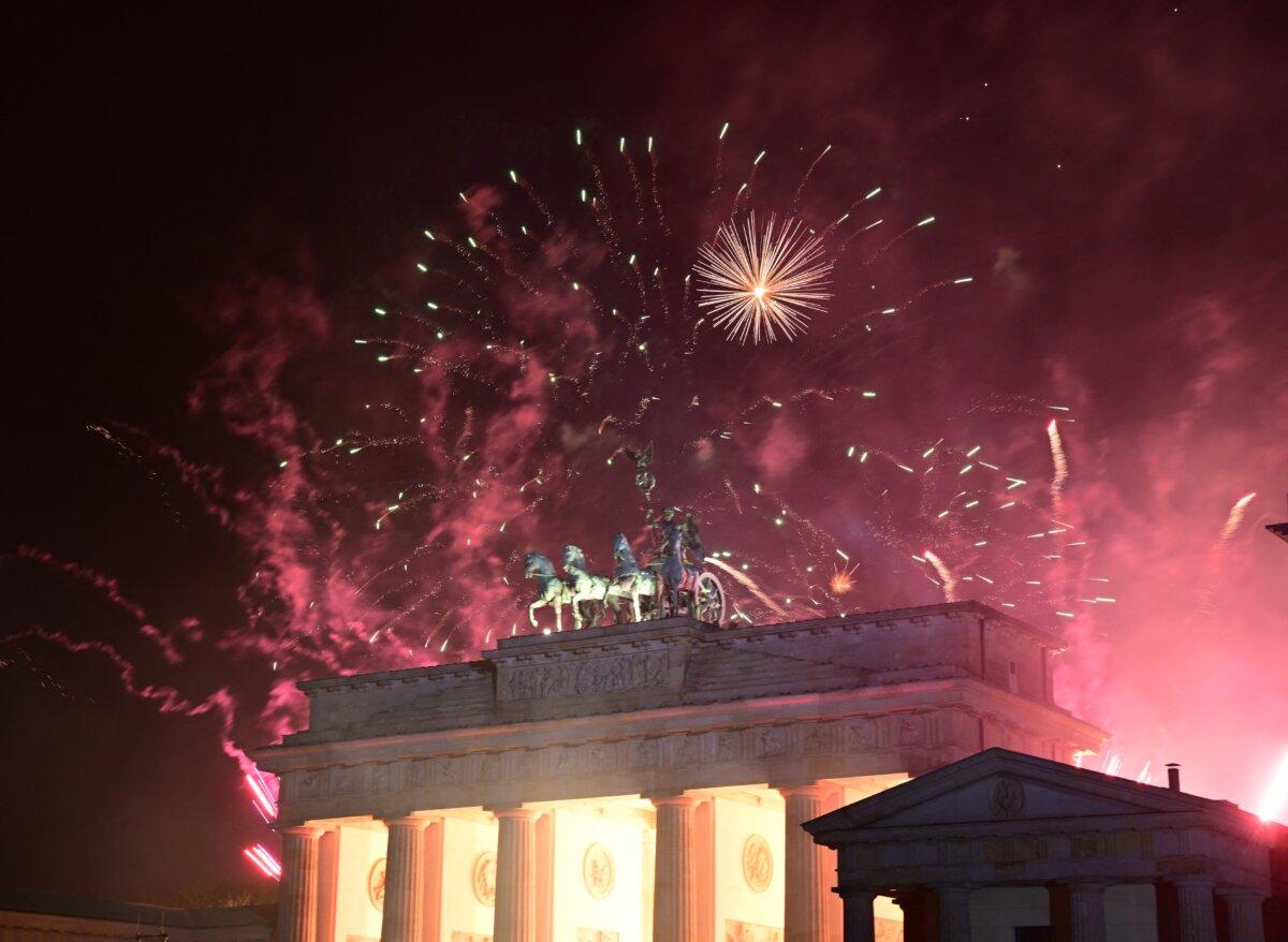 Fireworks illuminate the Quadriga atop the Brandenburg Gate during the New Year celebrations in Berlin on Jan. 1, 2025. (Tobias Schwarz/AFP via Getty Images)