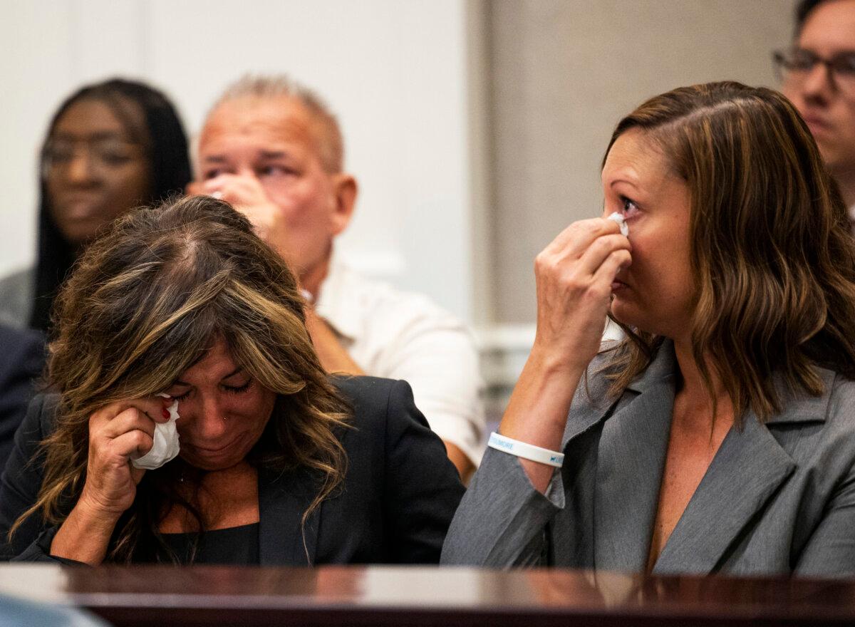 Lisa Miller (L) and her daughter Mandi Jenkins wipe tears from their eyes after testifying during a bond hearing for Jamie Lee Komoroski at the Charleston County Courthouse in Charleston, S.C., on Aug 1, 2023. (Gavin McIntyre/The Post And Courier via AP)