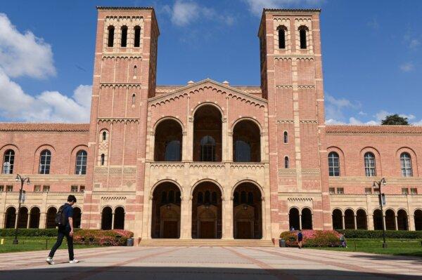 A student walks toward Royce Hall on the campus of the University of California at Los Angeles (UCLA) on March 11, 2020. (Robyn Beck/AFP via Getty Images)