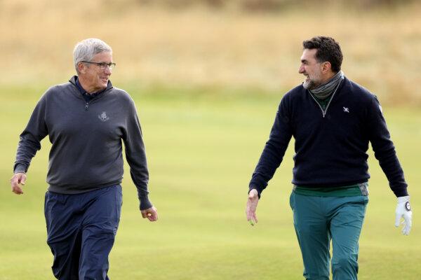 Jay Monahan, commissioner of the PGA Tour, and Yasir Al-Rumayyan, governor of Saudi Arabia's Public Investment Fund, talk during Day 1 of the Alfred Dunhill Links Championship 2024 at Carnoustie Golf Links in Carnoustie, Scotland, on Oct. 3, 2024. (Warren Little/Getty Images)
