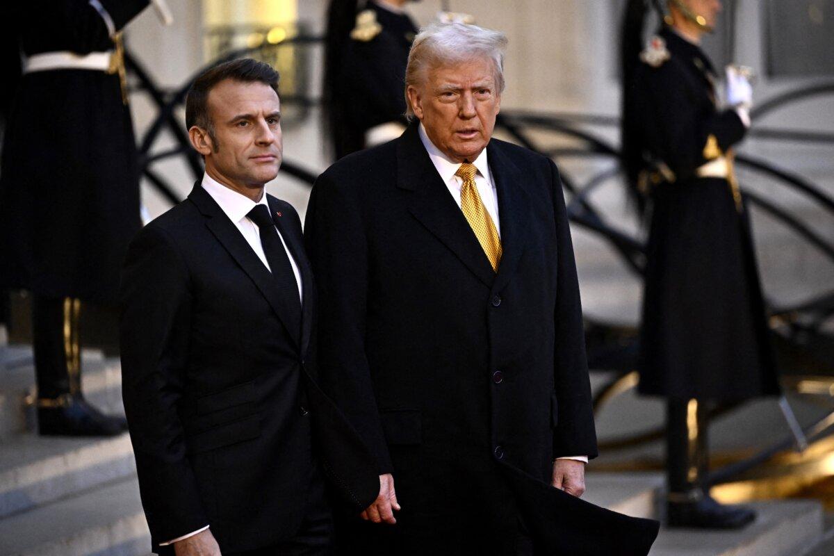 French President Emmanuel Macron welcomes U.S. President-elect Donald Trump before a meeting at The Elysee Presidential Palace in Paris on Dec. 7, 2024. (Julien de Rose/AFP via Getty Images)