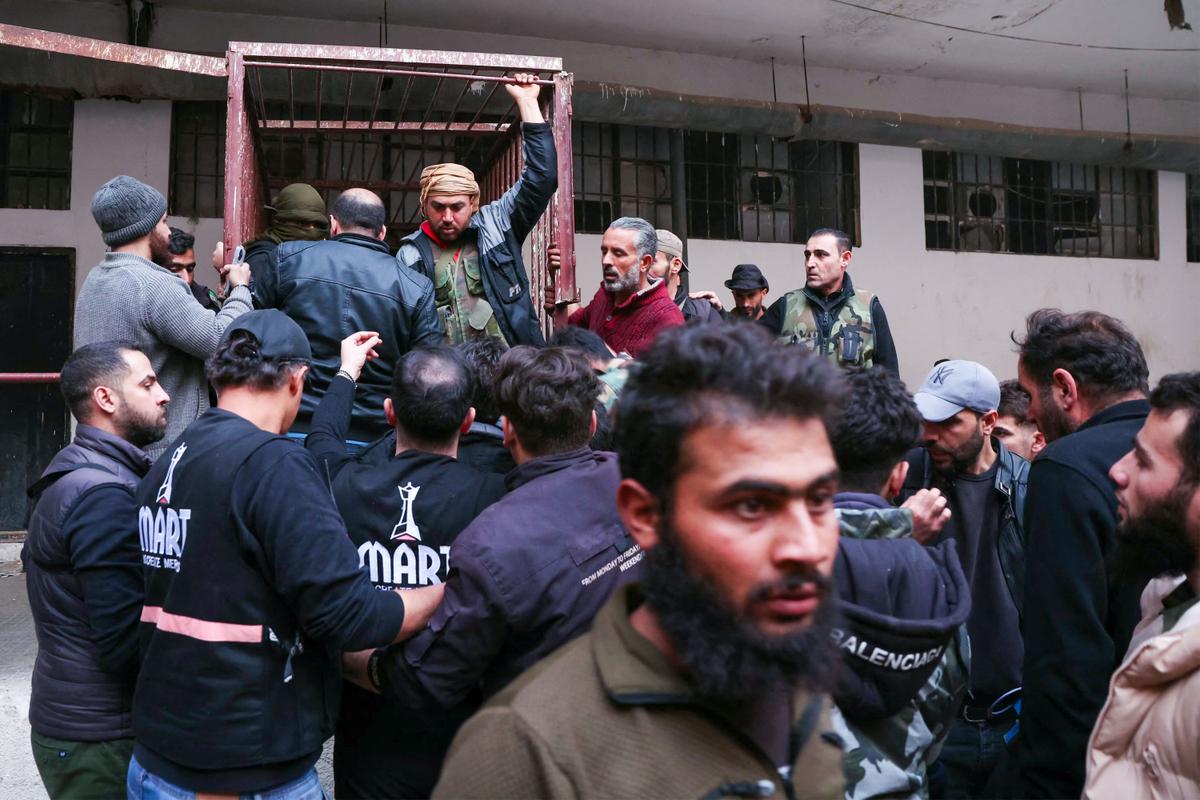 Syrian Rebels Start Power Transition as Search Begins for Assad’s Torturers thumbnail