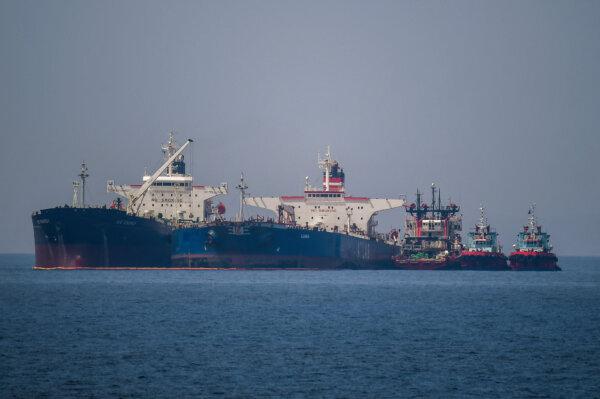 The Liberian-flagged oil tanker Ice Energy (L) transfers crude oil from the Russian-flagged oil tanker Lana (R) (formerly Pegas), off the shore of Karystos on the Island of Evia, Greece, on May 29, 2022. (Angelos Tzortzinis/AFP)