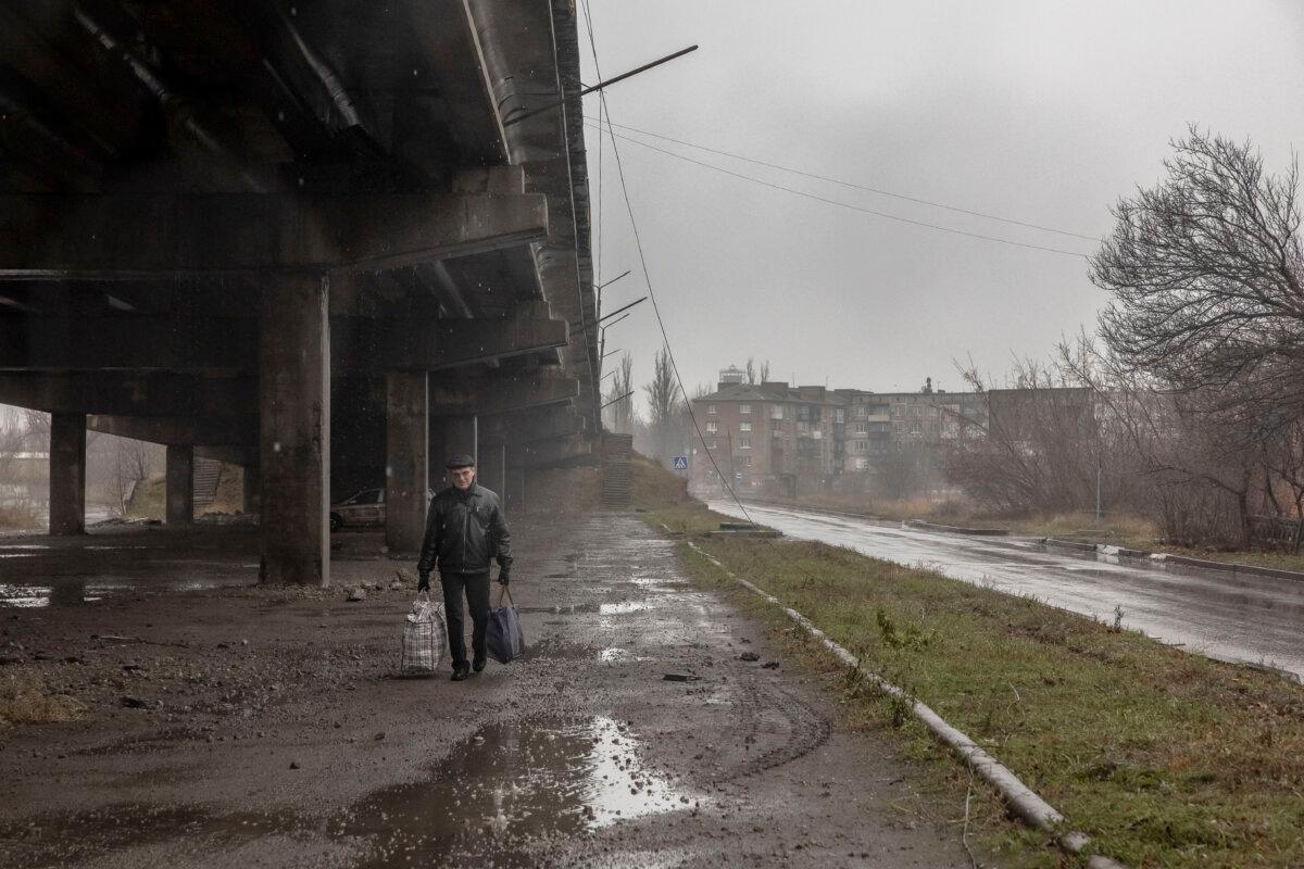 A local resident walks down the street in the embattled town of Pokrovsk, Ukraine, on Dec. 11, 2024. (Roman Pilipey/AFP via Getty Images)