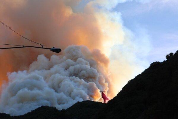Firefighters battle the Franklin Fire in Malibu, Calif., on Dec. 11, helped by several air tankers and helicopters. (Cal Fire)