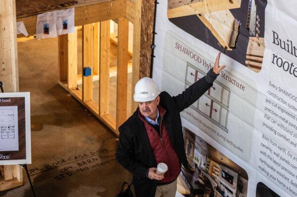 Troy Wood, manager for engineering for homebuilder Sekisui House, explains on Monday the proprietary metal joints that are used to connect the laminated beams and posts in the Shawood homes. (Hector Amezcua/The Sacramento Bee/TNS)