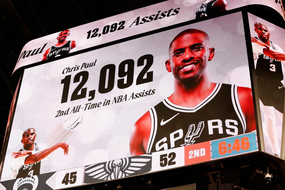 Sign showing Chris Paul's 2nd all-time NBA assist during a game against the New Orleans Pelicans in the first half at Frost Bank Center on Dec. 8, 2024, in San Antonio, Texas. (Ronald Cortes/Getty Images)