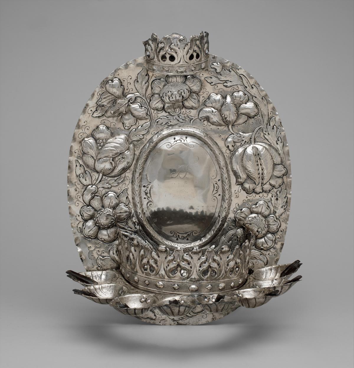Hanukkah lamp, late 17th century, from Hamburg, Germany. Silver, embossed and engraved; 13 1/2 inches by 10 1/2 inches. The Metropolitan Museum of Art, New York City. (Public Domain)