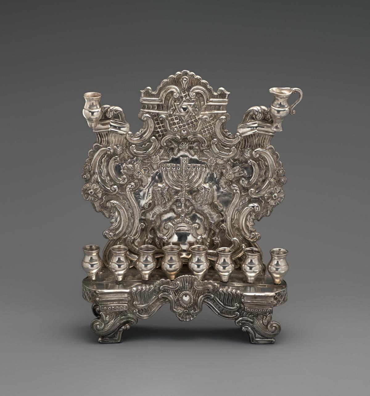 Hanukkah lamp, circa 1830, by Pietro Borrani. Silver; 11 15/16 inches by 9 3/8 inches by 2 3/8 inches. The Metropolitan Museum of Art, New York City. (Public Domain)